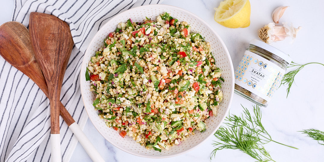 A colourful Gluten-Free Mediterranean Sorghum Salad with fresh herbs, red bell pepper, shallots, and crumbled feta