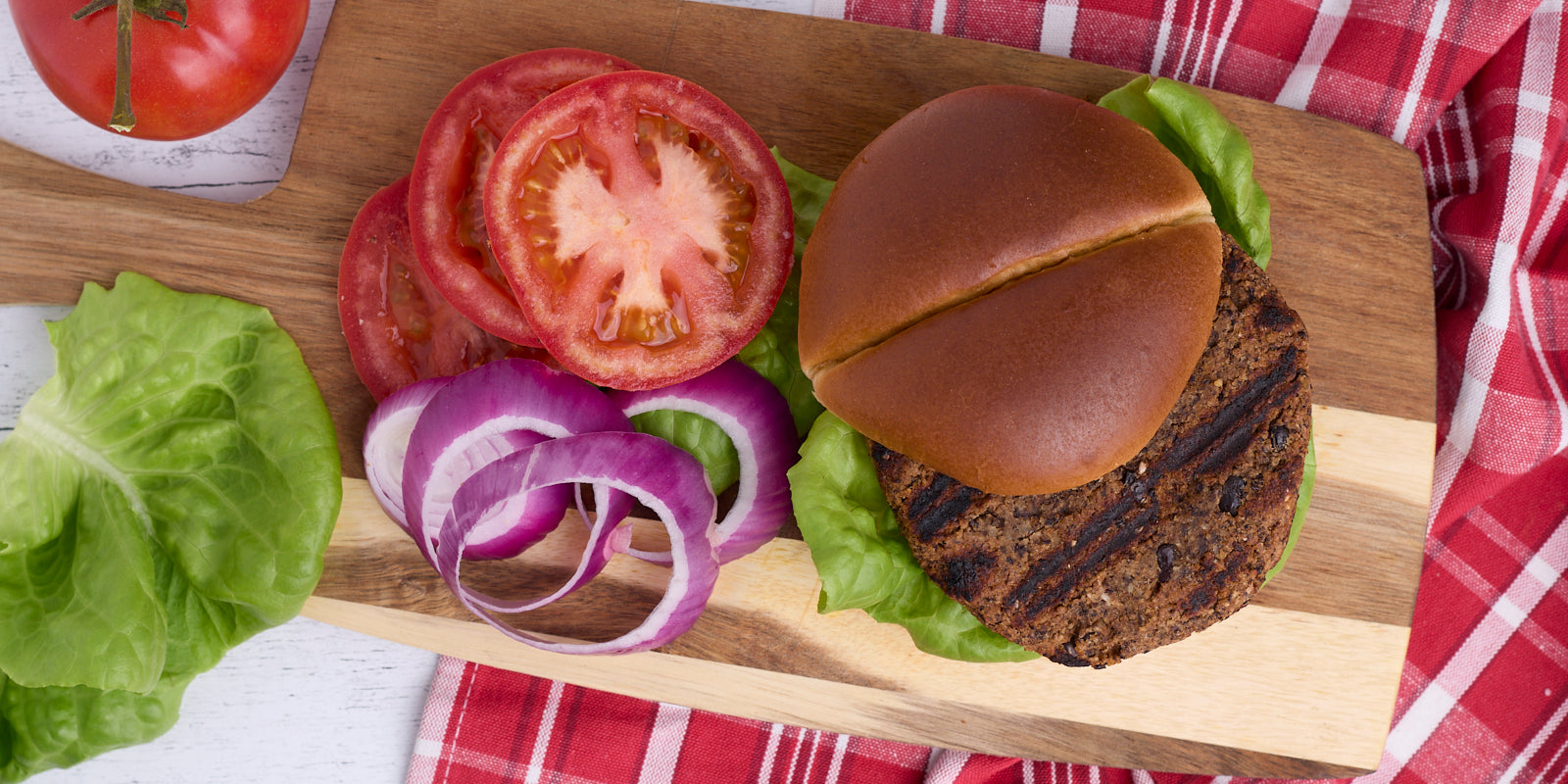 black bean burger with tomato, onion and lettuce