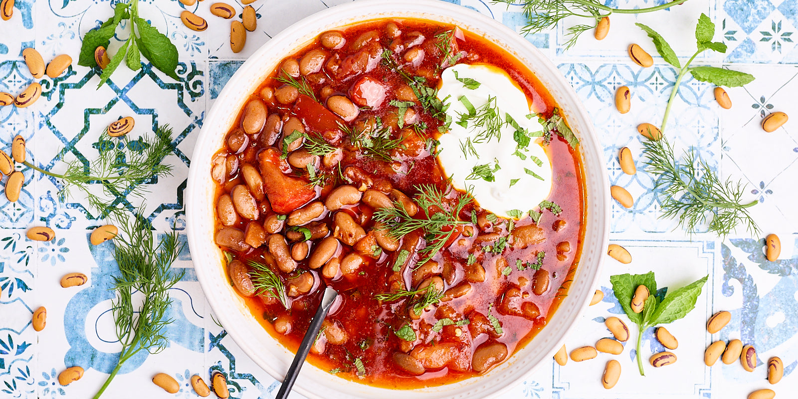 Bowl of colorful tiger eye beans in a red broth