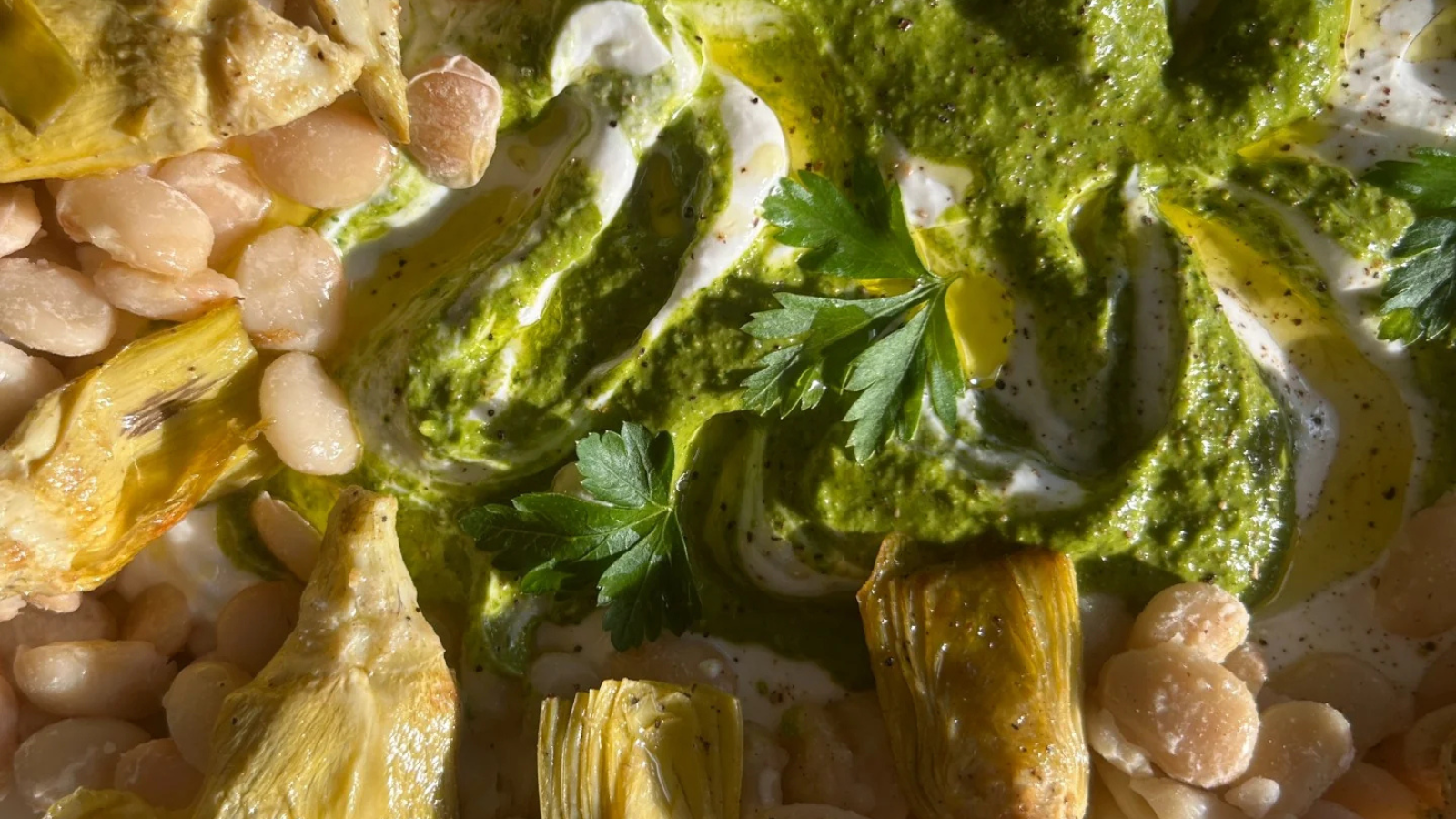 Baby Butter beans with artichokes and swirled spring sauce