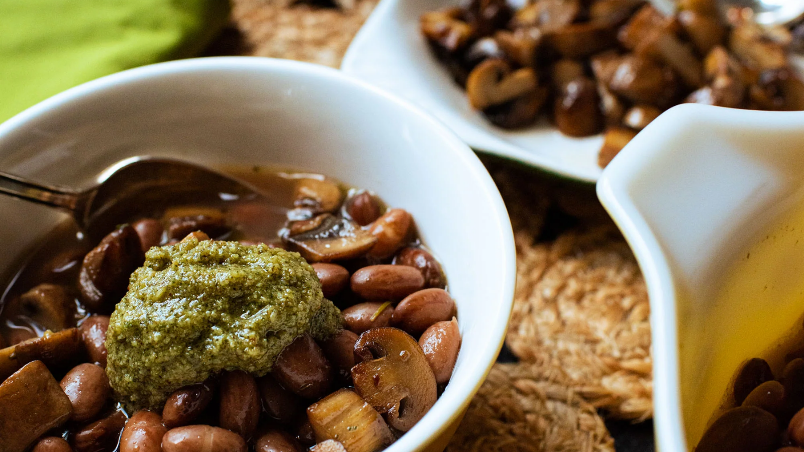 Brothy beans with sautéed mushrooms and sage pesto