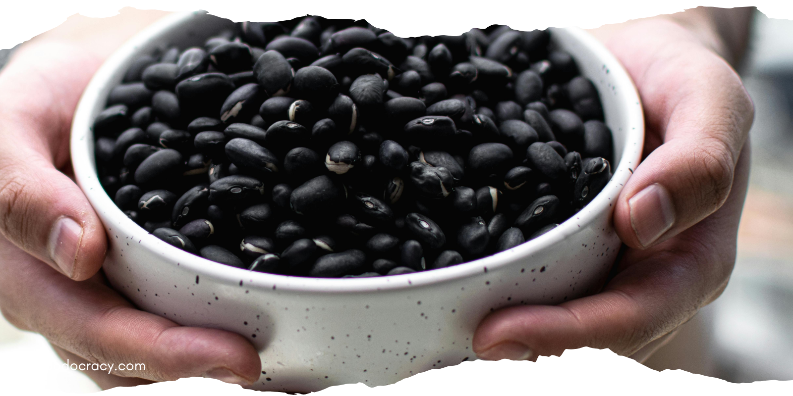holding a bowl of beans