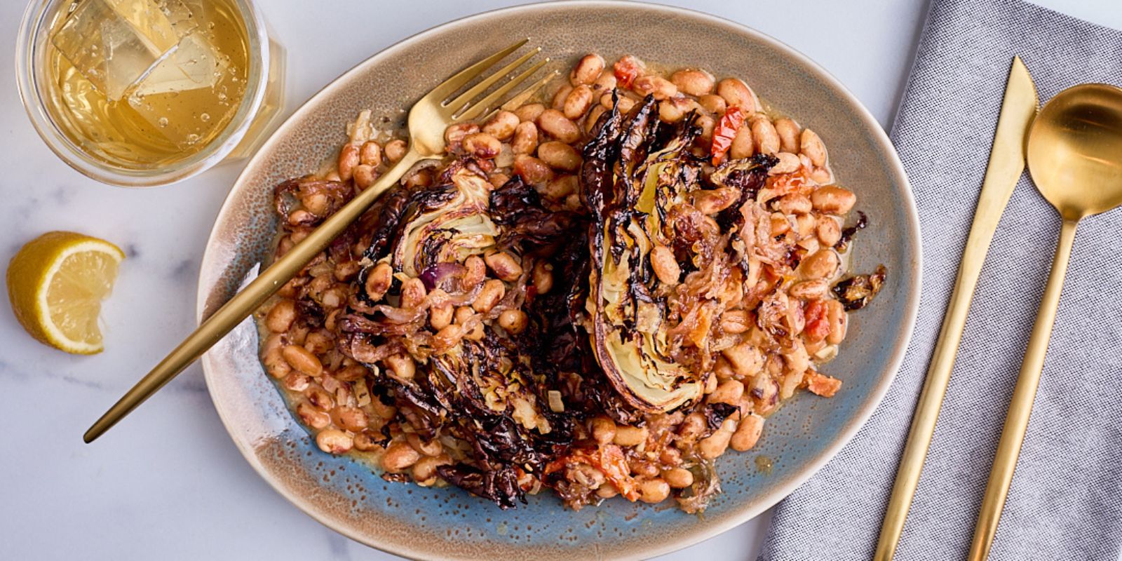 Charred Cabbage With Miso Beans, Sundried Tomato and Frizzled Onions