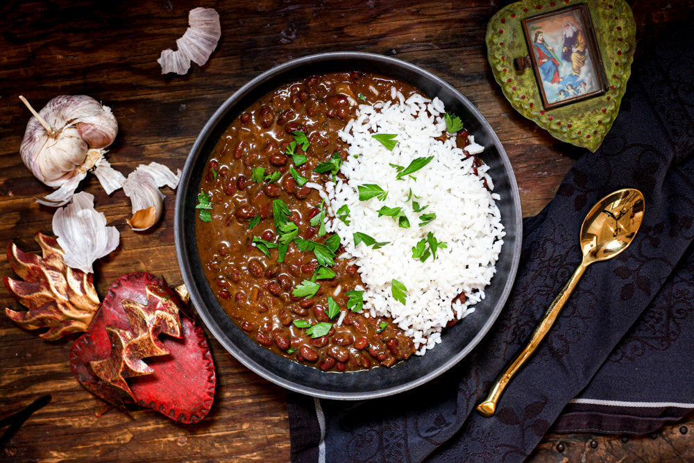 bowl of red beans and rice on dark background