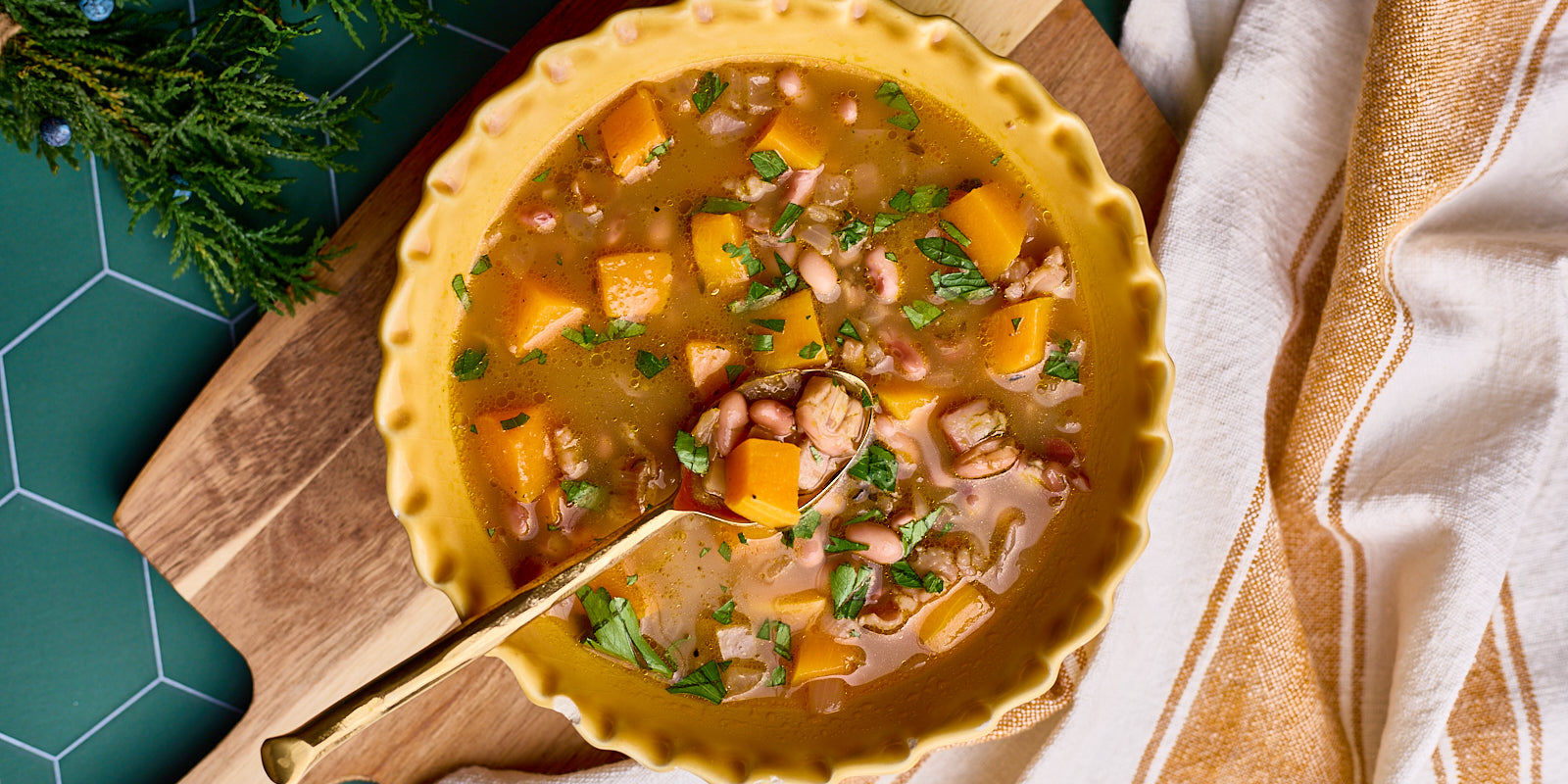 rustic soup with butternut squash, beans and hominy