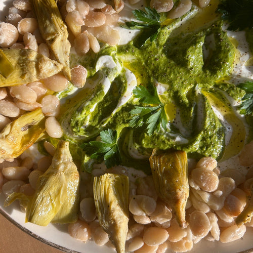 Baby Butter beans with artichokes and swirled spring sauce