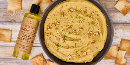 thai curry hummus next to green peanut oil