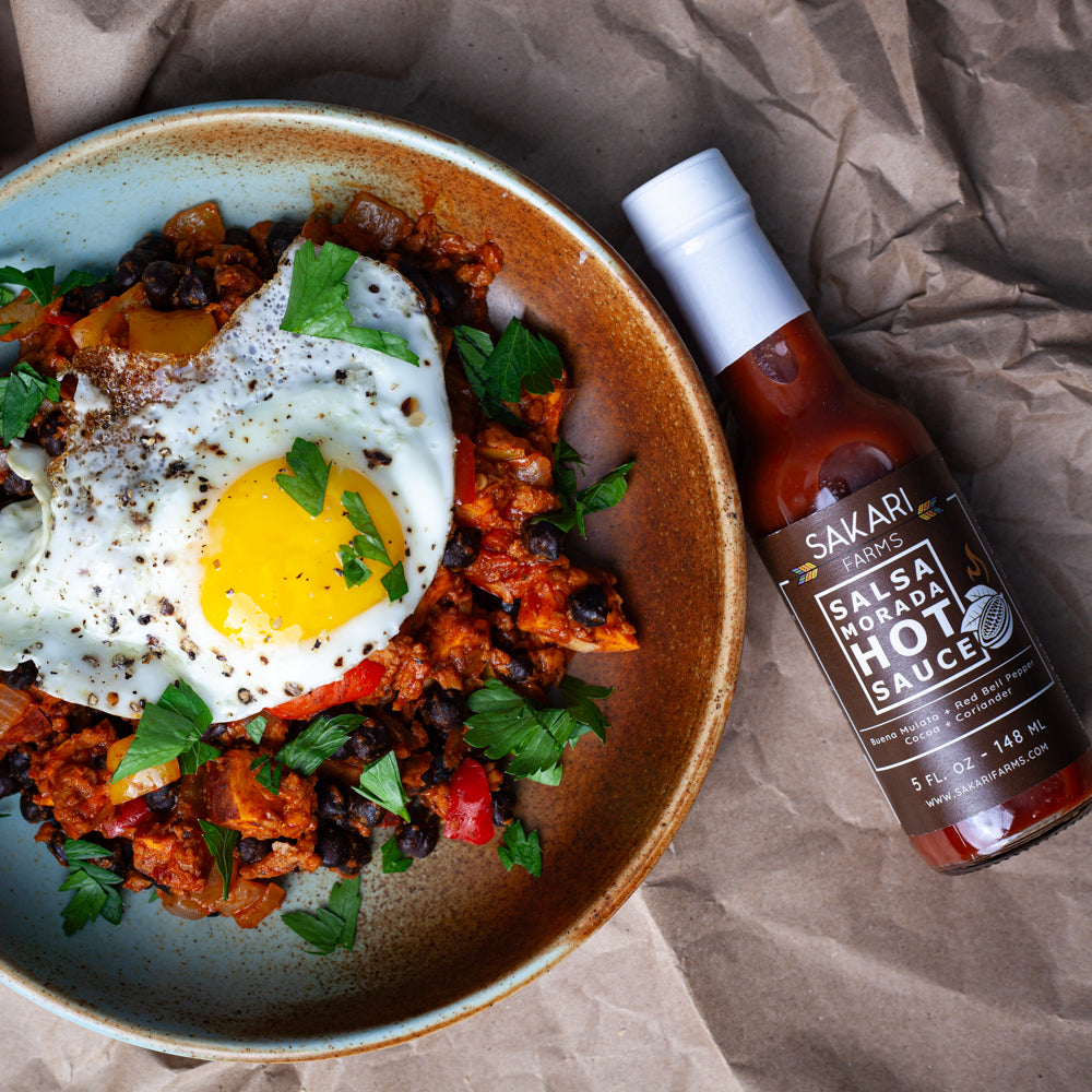 black garbanzo bean hash with salsa morada hot sauce