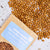 Bag of Old Indian Woman Heirloom Beans with beans spilling out on a light background
